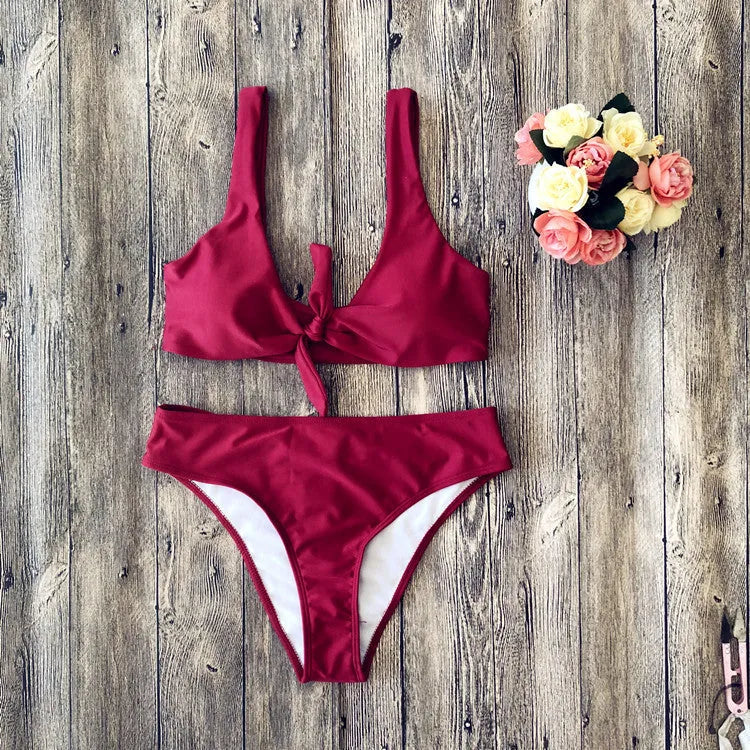 Women's two-piece bikini set in a solid colour on a white background, showing sleeveless bra and briefs.