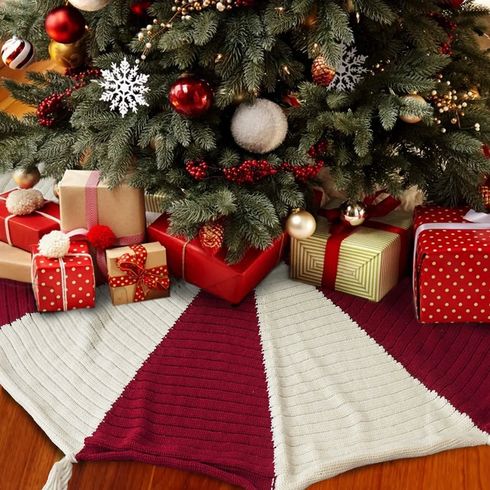 Red and white knitted Christmas tree skirt measuring 122cm square with tassel decoration