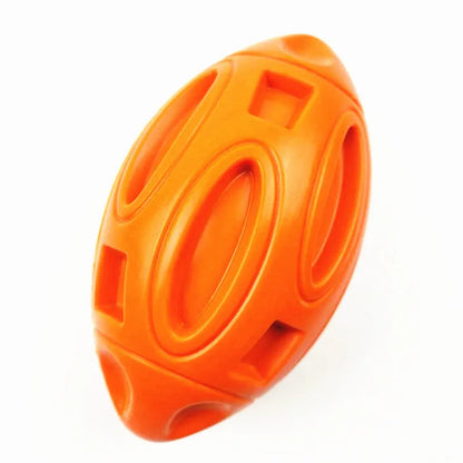Natural rubber squeaky dog chew ball with surface grooves for medium and large breed dogs