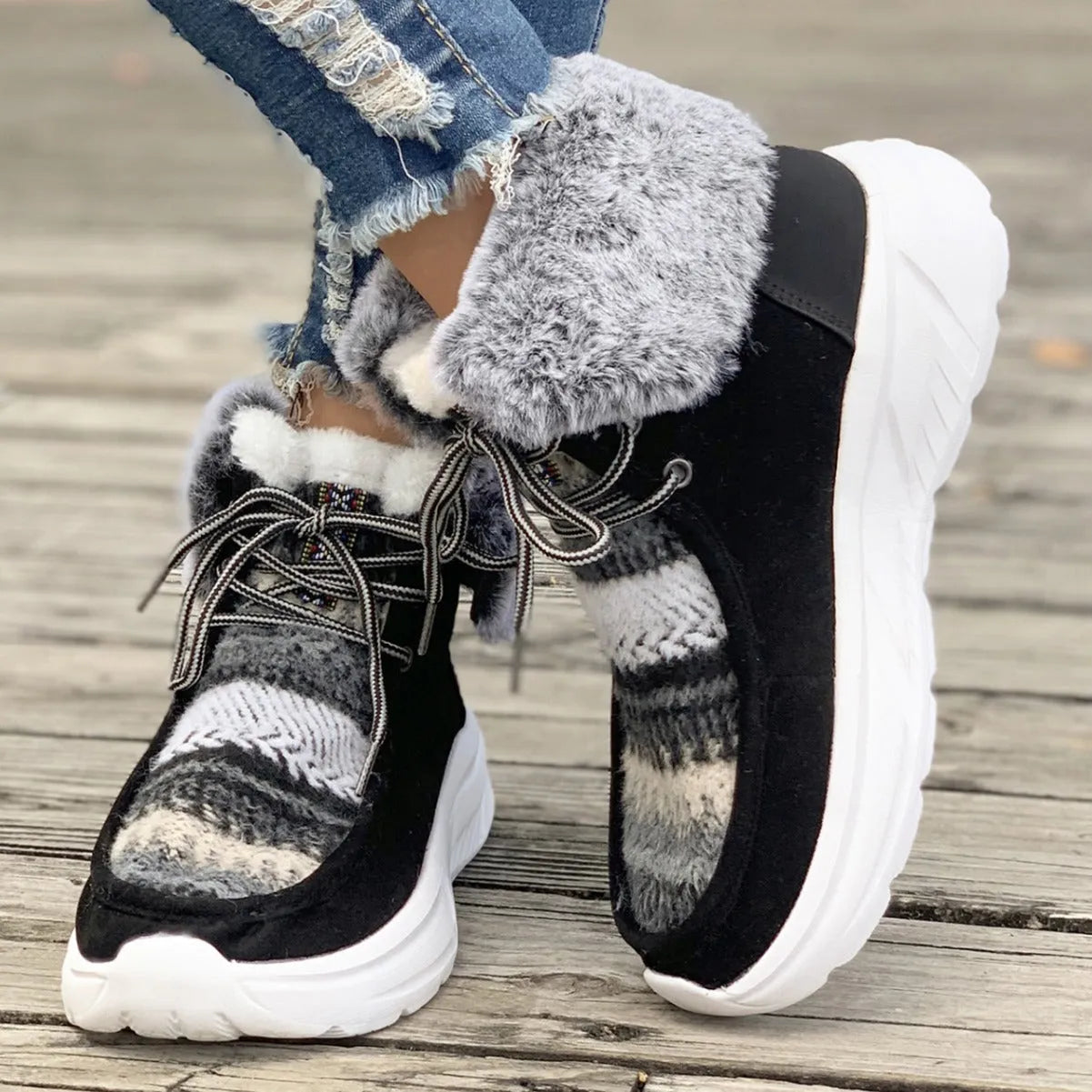 Women's lace-up snow boots in beige with suede upper, thermal fur lining, and non-slip rubber sole on a winter background