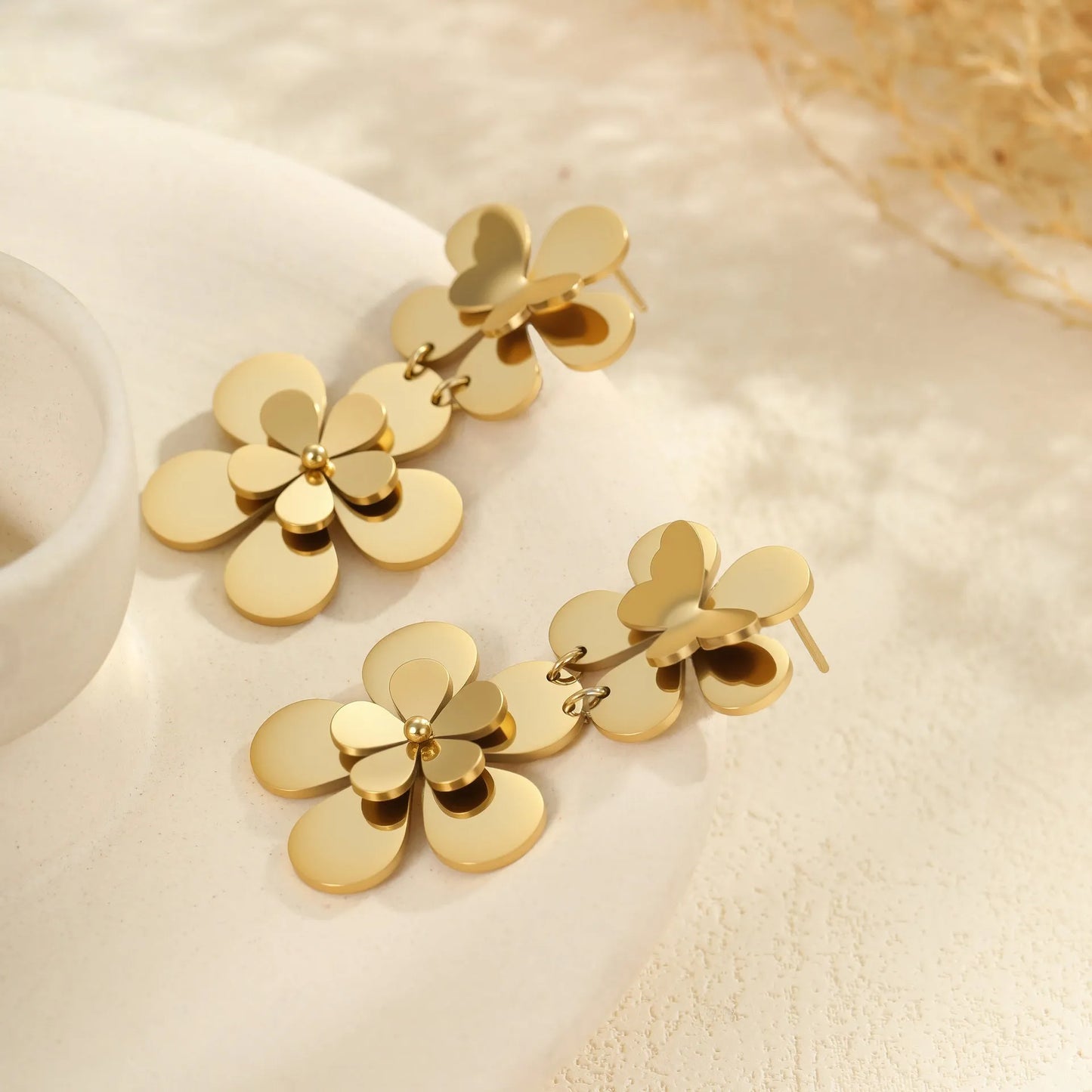 Gold electroplated stainless steel flower butterfly earrings for women with geometric and animal zodiac designs