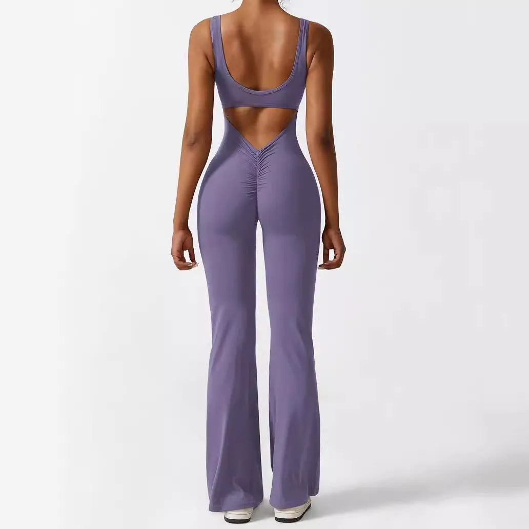 Women's sleeveless flare jumpsuit for yoga in high elasticity polyester fabric.
