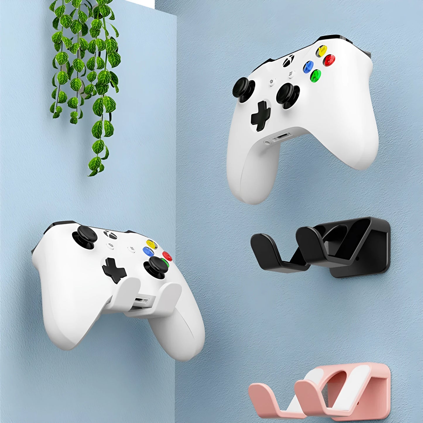 Black ABS plastic wall hanging rack with an X-shaped handle, shown with adhesive gel and screws for mounting.