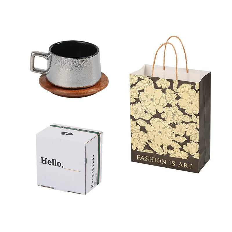 Office gift set showing stainless steel travel tumbler inside a gold-plated presentation box with optional gift bag.