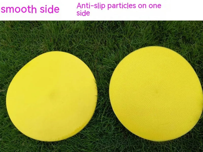 Soft yellow TPE football landmark pad disc on grass, 23 cm diameter.
