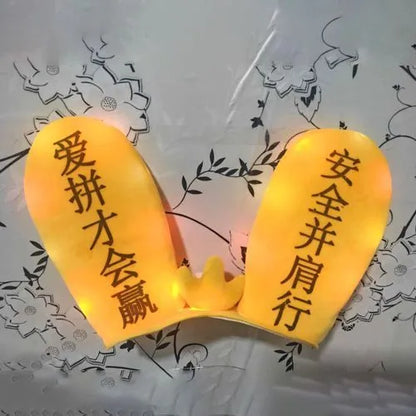 Rabbit ear ski helmet ornament with LED lighting and Velcro base attachment for helmet customisation