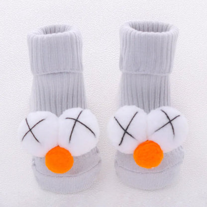 Cotton baby floor socks in assorted colours and patterns including bows, stars, and animal designs.
