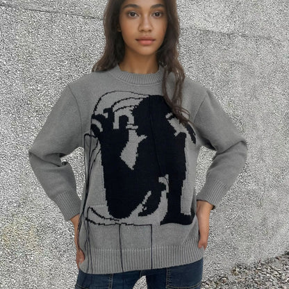 Women's grey alpaca wool sweater with abstract pattern and tassel design on regular sleeves
