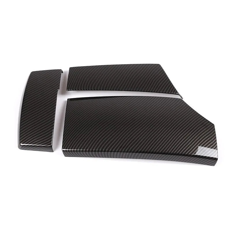 Set of three black ABS plastic armrest box covers with a shiny carbon fibre weave pattern.