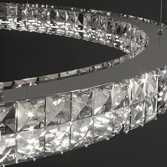 Modern crystal LED chandelier with adjustable height mechanism and multiple crystal elements