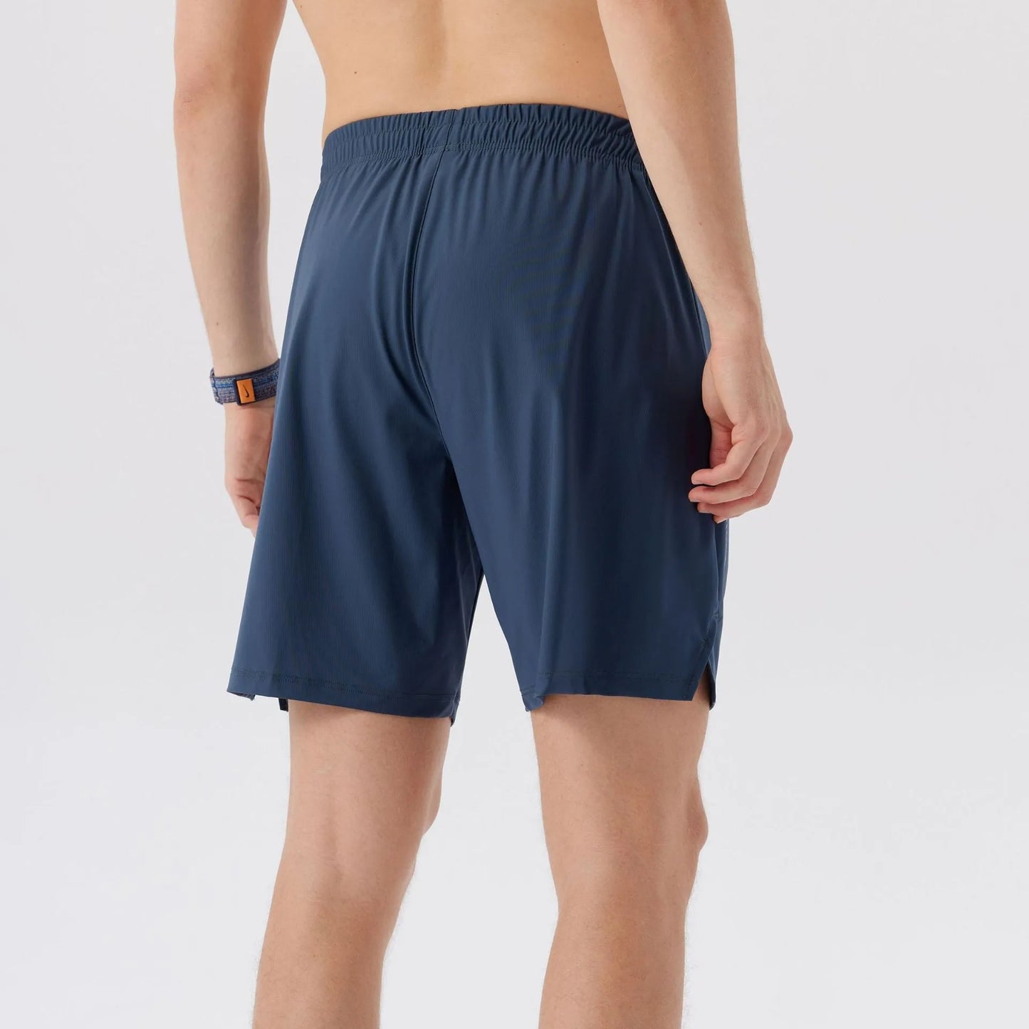 Men's black nylon sports shorts with a mid waist, designed for athletic and casual leisure wear.