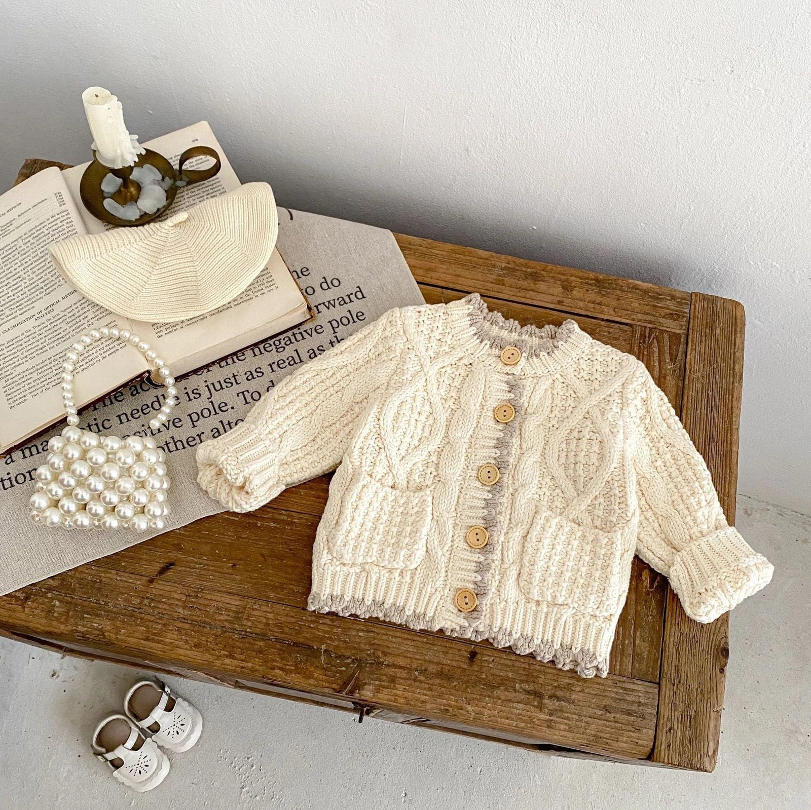 Girls' apricot white cotton knitted coat with round neck, shown in various height sizes from 66cm to 100cm