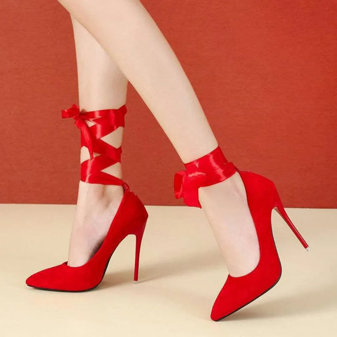 Black pointed toe stiletto sandals with a lace strap and high heel