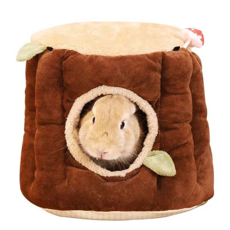 Brown cloth hanging winter stump nest for rabbits, shown in a small animal cage.