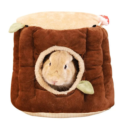 Brown cloth hanging winter stump nest for rabbits, shown in a small animal cage.