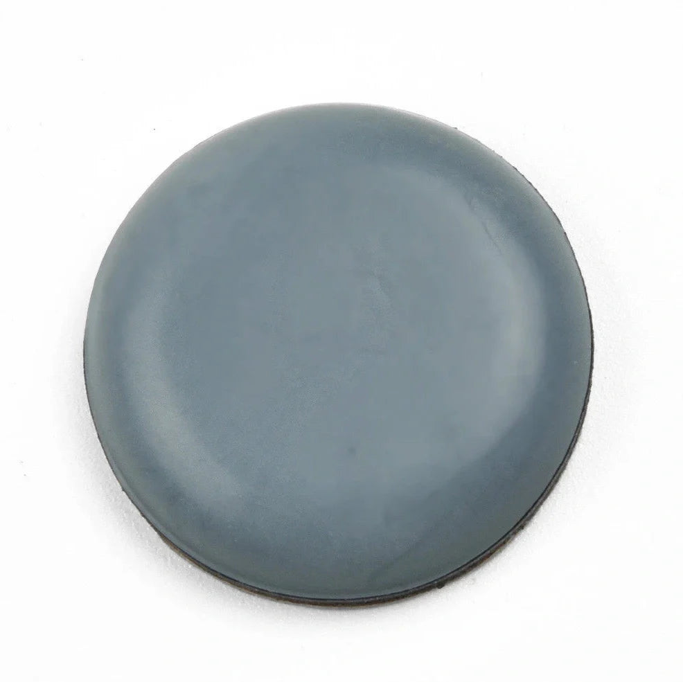 Blue-grey adhesive furniture slip pads measuring 22mm diameter for floor protection