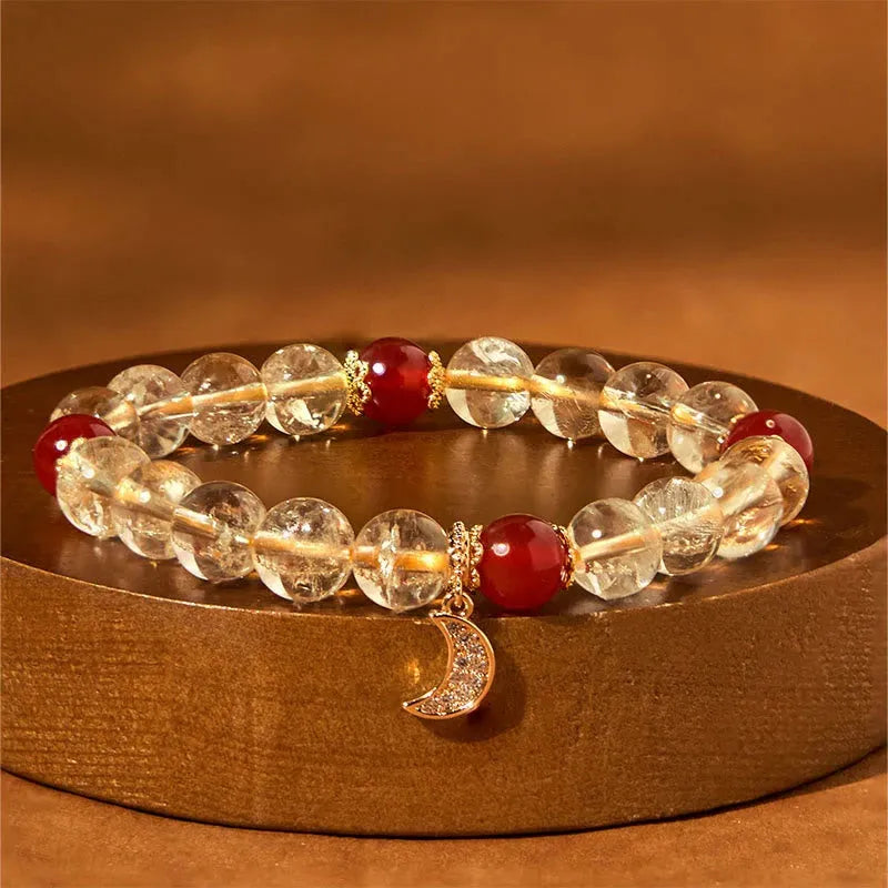 Citrine red agate moon boom crystal bracelet for women on a white background.
