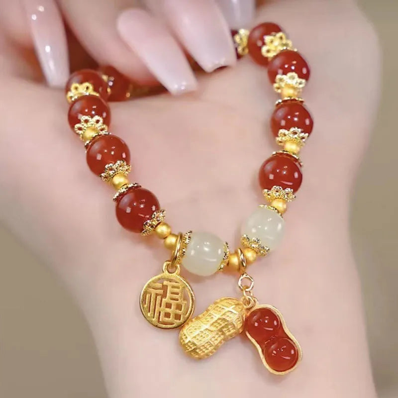 Chinese style glass bead bracelet with bamboo joint design on wrist.
