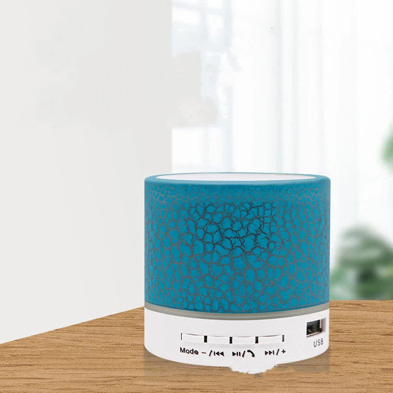 Portable Bluetooth speaker with colorful LED lights, offering impressive sound quality and convenient features for on-the-go music enjoyment.