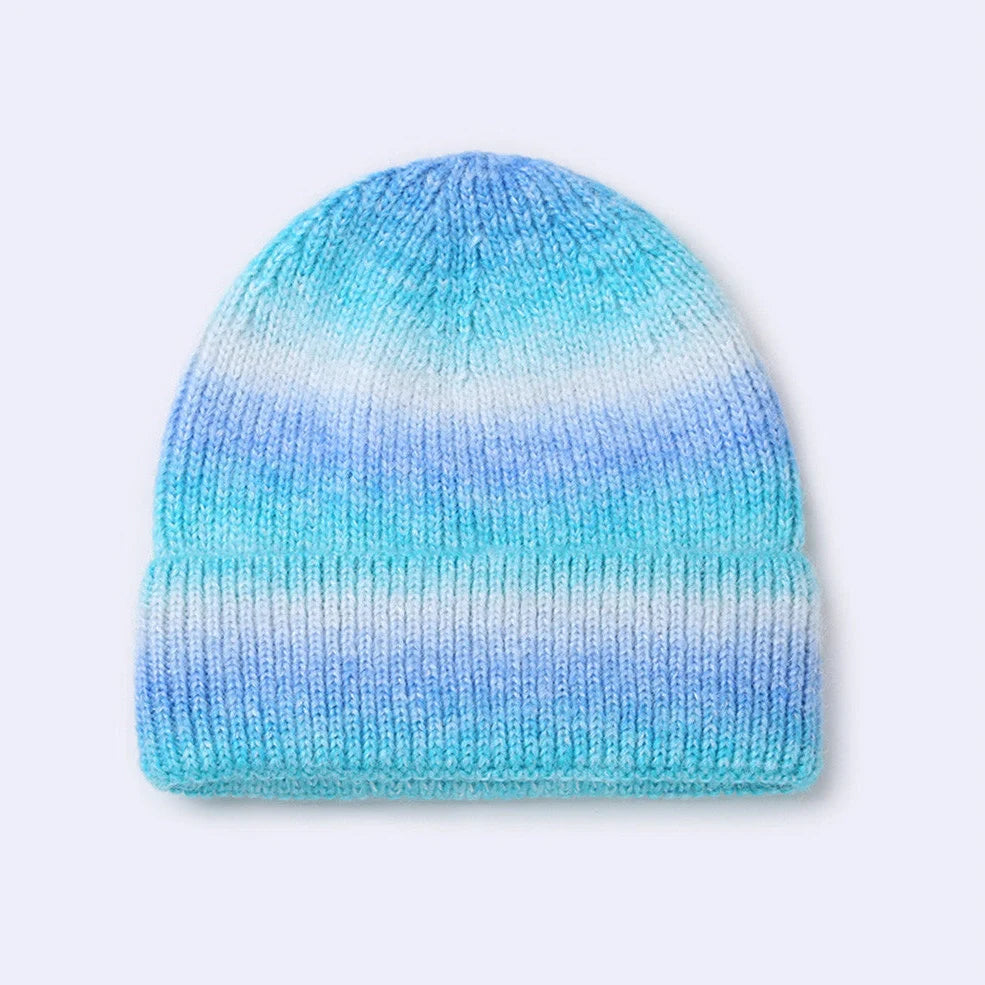 Gradient yarn knitted hat with tapered top in light blue colour showing knitted texture