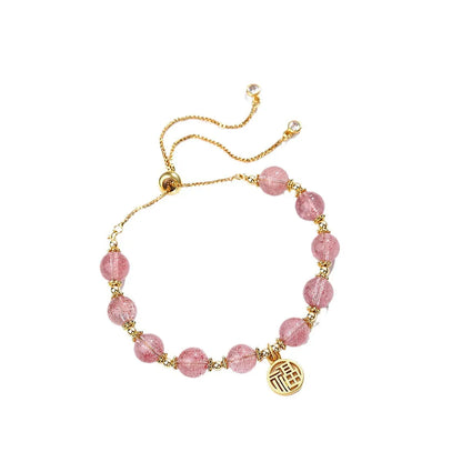Strawberry quartz bracelet with gold electroplated metal and engraved fu character geometric jewellery design