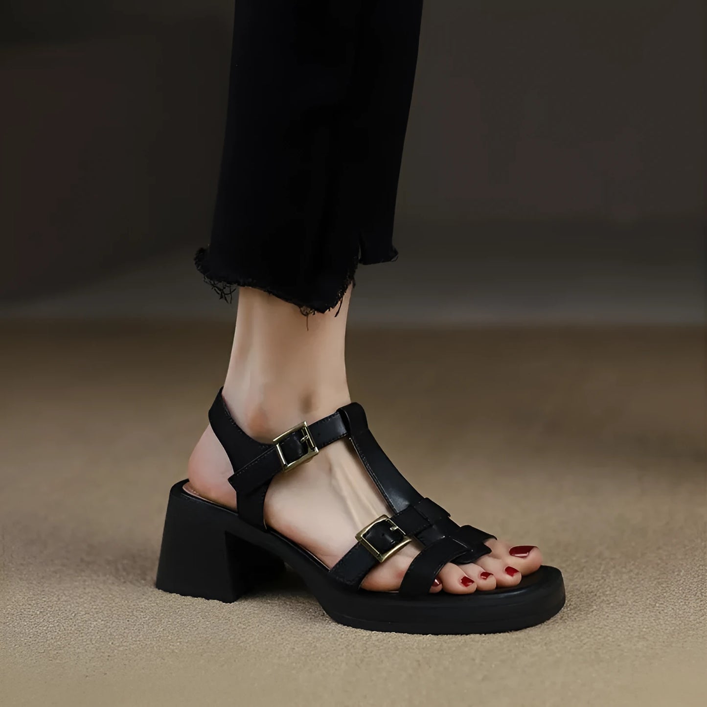 Black women's retro sandals with T-buckle, chunky heel, and open square toe.