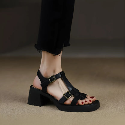 Black women's retro sandals with T-buckle, chunky heel, and open square toe.