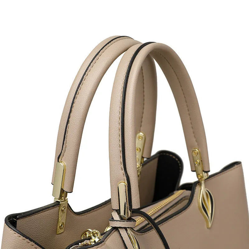 Women's black PU leather messenger bag with multi-layer shoulder strap and sewing thread detailing.