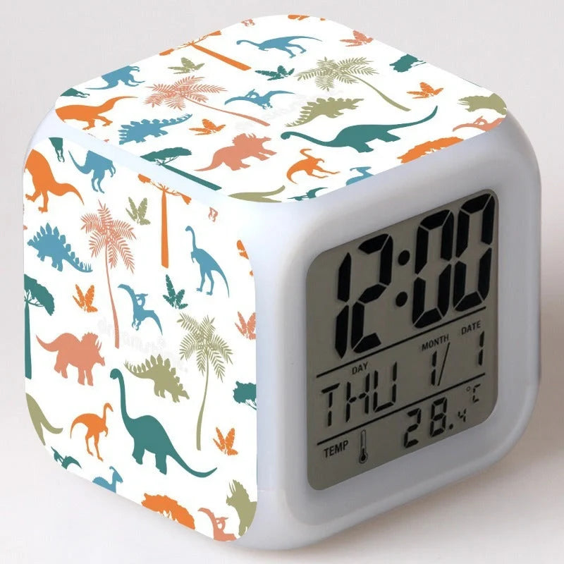 LED Cartoon Alarm Clock with voice control and digital display in pink, blue, green, and dinosaur designs