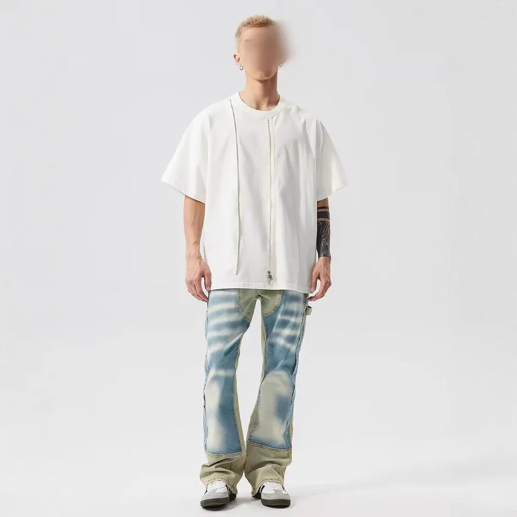 Yellow and blue patchwork splash-ink damaged design denim jeans with mid-waist cut and zip placket closure