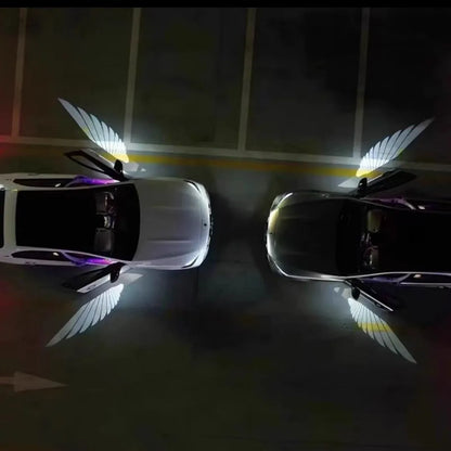 Universal car rearview mirror angel wings projection courtesy lamp with aluminium housing.