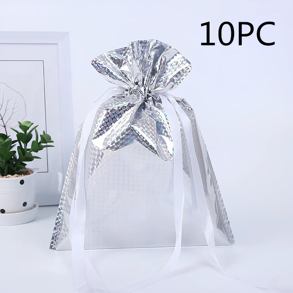 Christmas gift bag with drawstring closure in laser gold finish, 32x24cm dimensions