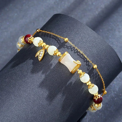 Retro bracelet with Ruyi flower design in glass and coloured glaze beads with electroplated accents