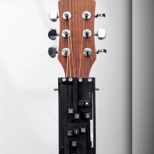 Black chord practice device for guitar beginners showing double chord design for transition practice