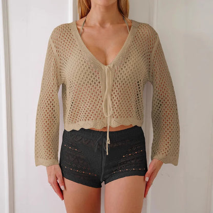 Women's hollow woven cardigan blouse with bell sleeves in apricot colour, showing textured fabric and nine-quarter sleeve length