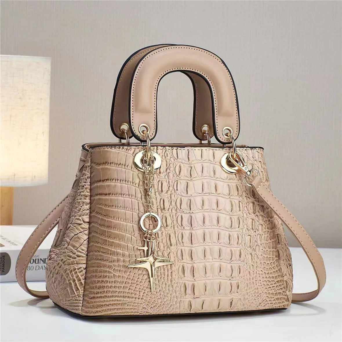 Women's PU shoulder bag with single strap, horizontal square shape, embossed finish and zip change pocket in beige