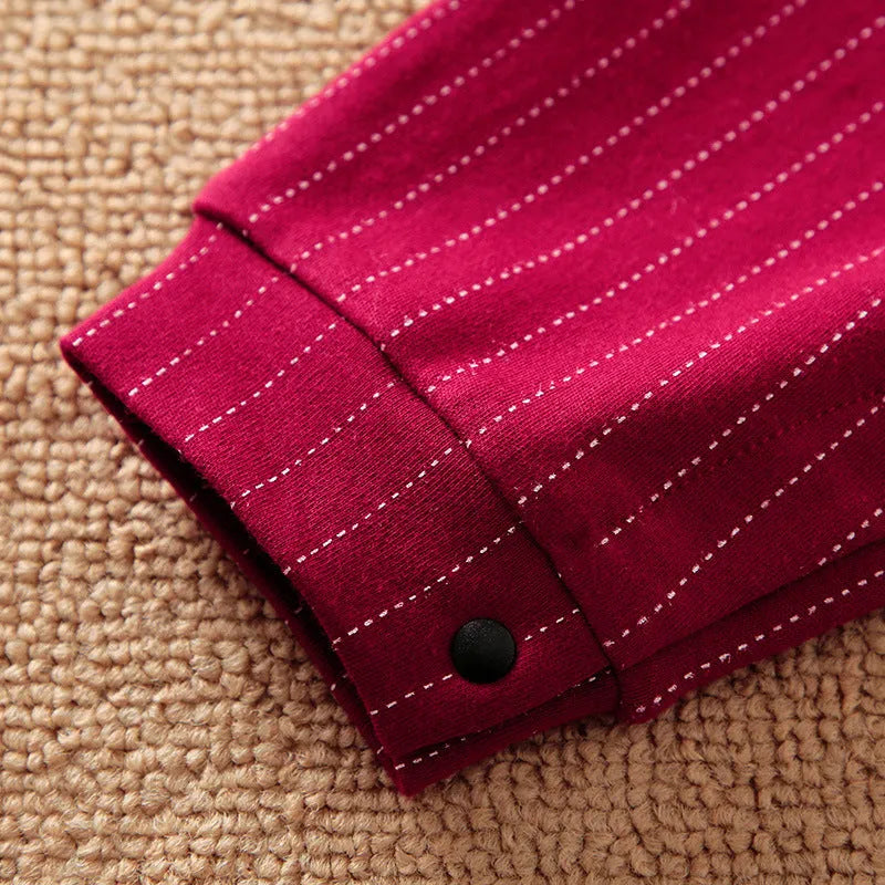 Wine red cotton baby boy's romper with long sleeves and single-breasted closure.