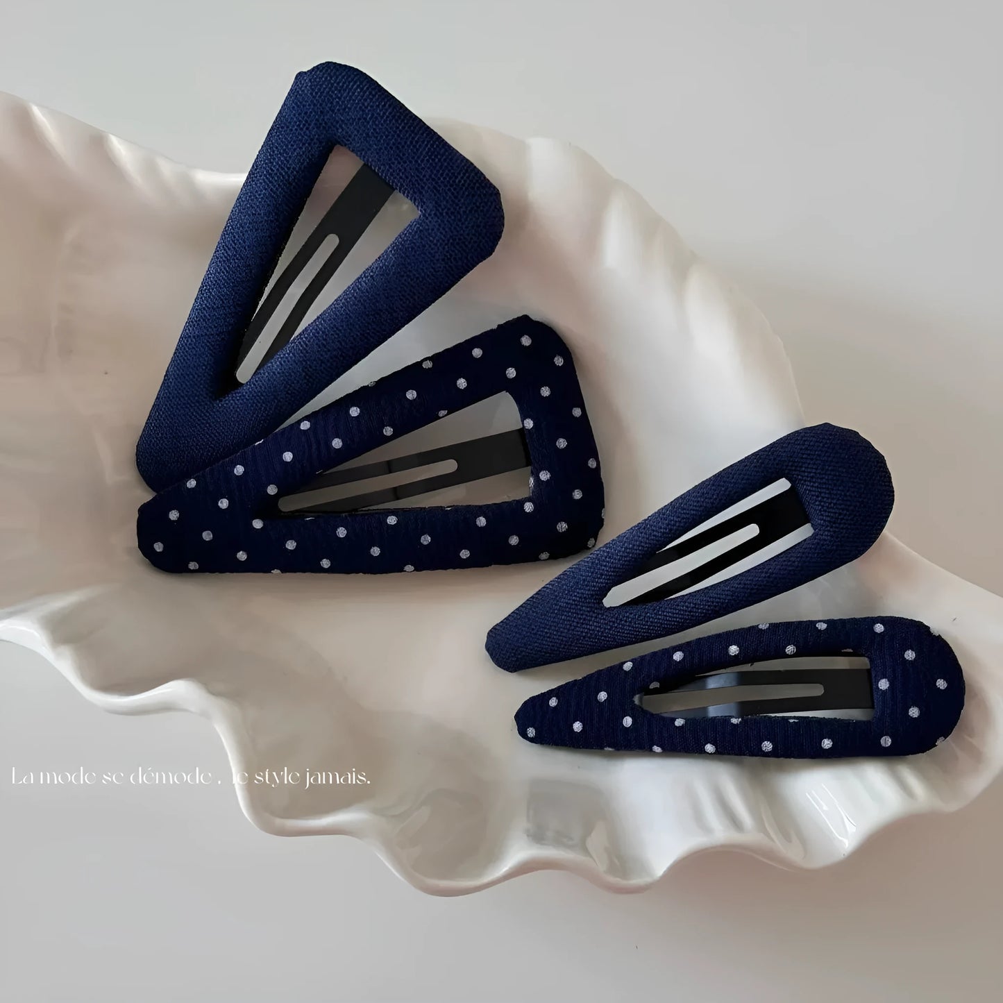 French retro dot pattern barrettes in triangle and water drop shapes with dark denim styling