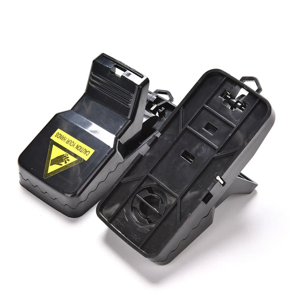 Six black plastic snapping mousetraps showing quick-kill mechanism and compact 11cm size