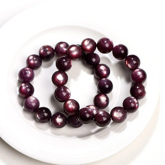 Purple lepidolite crystal bracelet with polished round beads in geometric design on wrist
