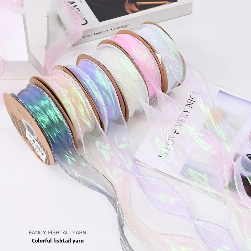 Fishtail yarn ribbon roll showing 4cm width and edge cutting detail in illusion colour options