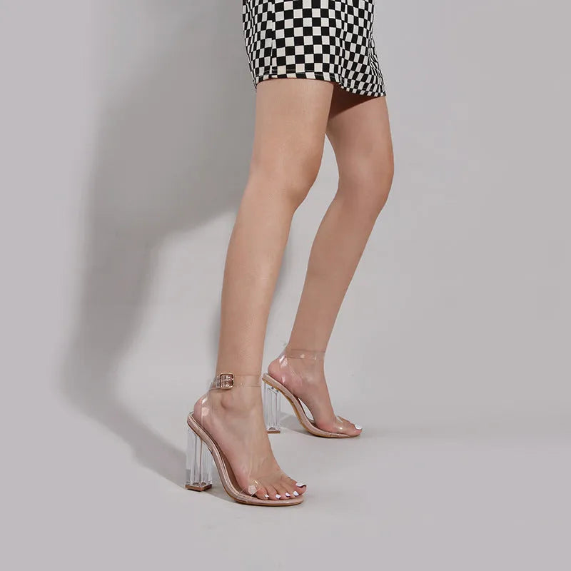 Apricot women's high heel sandals with clear glass heel and silver buckle on a melamine sole.