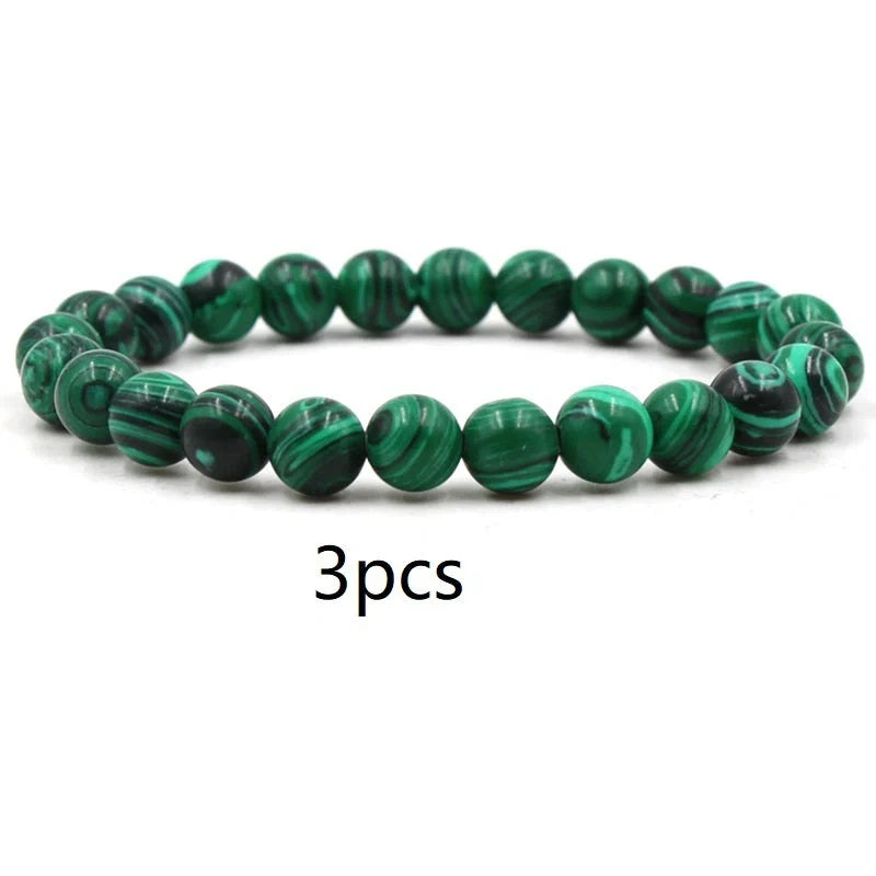 Elegant malachite stone bracelets with unique textures and patterns, perfect for a stylish accessory.