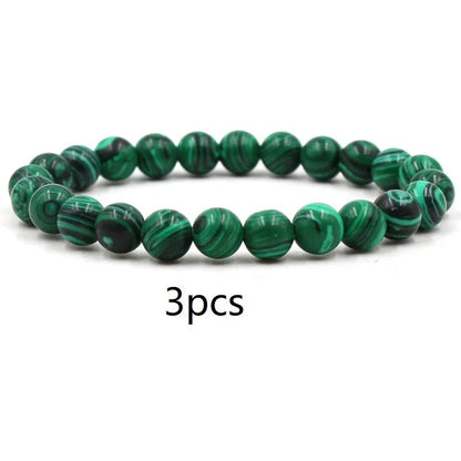 Elegant malachite stone bracelets with unique textures and patterns, perfect for a stylish accessory.