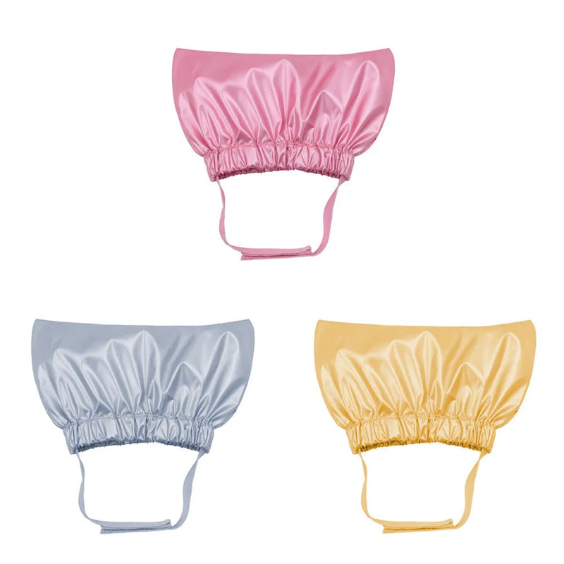 Dog and cat shower cap in non-woven fabric for pet bath time ear protection, available in silver, pink and gold colours with adjustable fit and waterproof monochrome printing design.