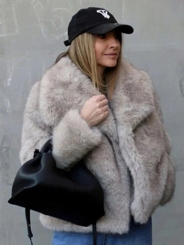 A warm and stylish plush coat for women, available in a variety of colors and sizes.