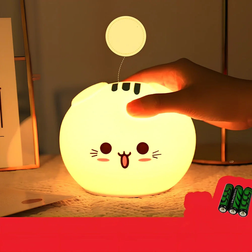 Silicone night light with fold-eared cat design showing LED illumination and USB charging port