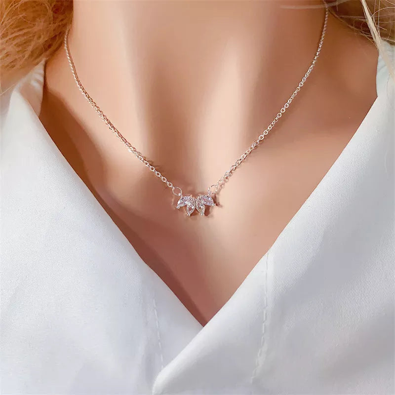 Minimalist lotus flower petal necklace in gold or silver, perfect for women and girls.