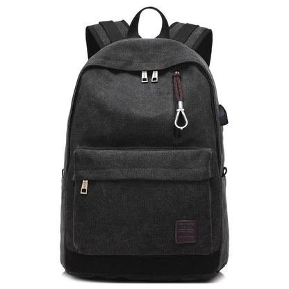 Coffee-coloured canvas backpack with USB charging port on side strap and front zipper pocket.