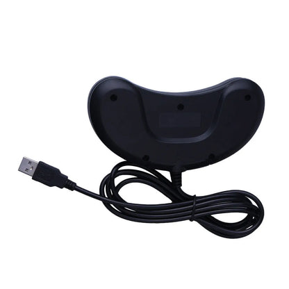 Black Sega-style USB game controller for PC with a long braided cable on a desk